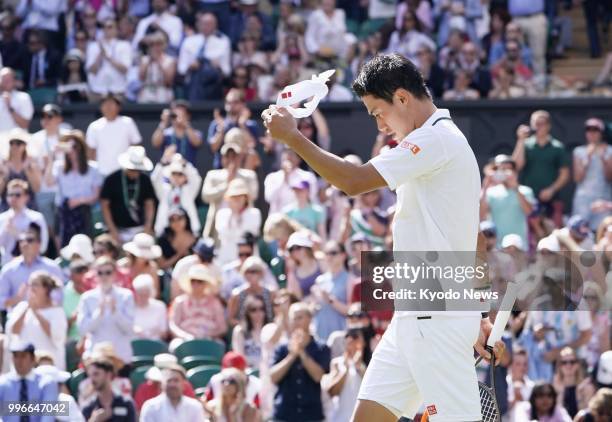 Kei Nishikori of Japan looks dejected after losing to Novak Djokovic of Serbia in the quarterfinals at Wimbledon in London on July 11, 2018. ==Kyodo