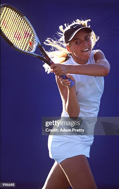 Alienor Tricerri of Switzerland in action during her match against Nicole Pratt of Australia during the Fed Cup tie between Australia and Switzerland...