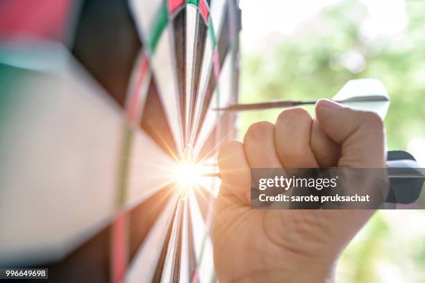 dart is an opportunity and dartboard is the target and goal. opportunity, risk management, business concept - risk scoring stock pictures, royalty-free photos & images