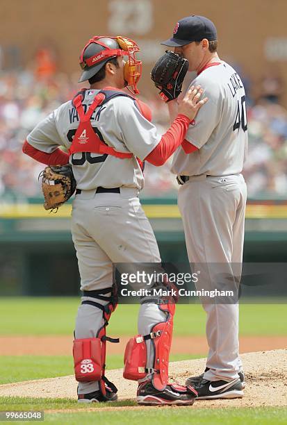 Jason Varitek of the Boston Red Sox talks with pitcher John Lackey on the mound during the game against the Detroit Tigers at Comerica Park on May...