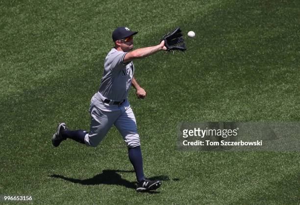 Brett Gardner of the New York Yankees catches a soft liner to center field in the fourth inning during MLB game action against the Toronto Blue Jays...