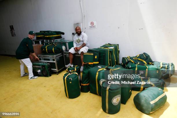 Clubbie Sean of the Oakland Athletics watches over the bags on get away day during the game against the Los Angeles Angels of Anaheim at the Oakland...