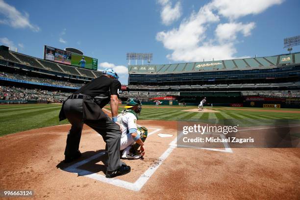 Daniel Mengden of the Oakland Athletics warms up from the mound prior to the game against the Los Angeles Angels of Anaheim at the Oakland Alameda...