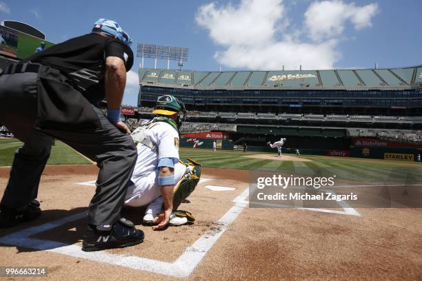 Daniel Mengden of the Oakland Athletics warms up from the mound prior to the game against the Los Angeles Angels of Anaheim at the Oakland Alameda...