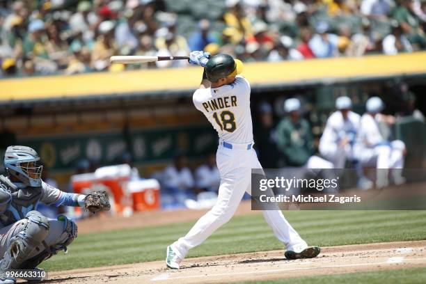 Chad Pinder of the Oakland Athletics bats during the game against the Los Angeles Angels of Anaheim at the Oakland Alameda Coliseum on June 17, 2018...