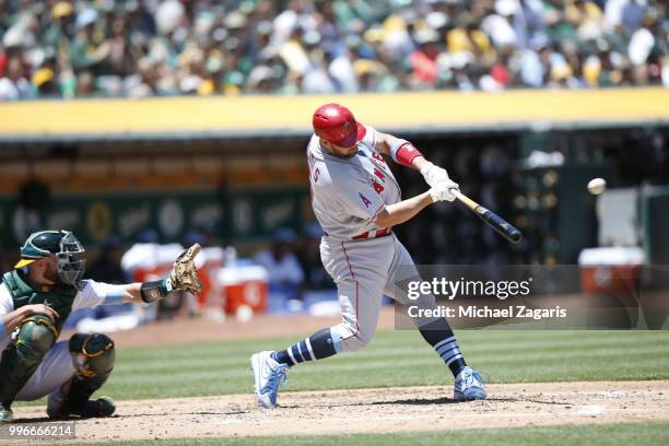 Mike Trout of the Los Angeles Angels of Anaheim bats during the game against the Oakland Athletics at the Oakland Alameda Coliseum on June 17, 2018...