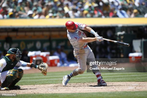 Mike Trout of the Los Angeles Angels of Anaheim bats during the game against the Oakland Athletics at the Oakland Alameda Coliseum on June 17, 2018...