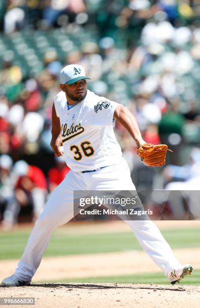 Yusmeiro Petit of the Oakland Athletics pitches during the game against the Los Angeles Angels of Anaheim at the Oakland Alameda Coliseum on June 17,...
