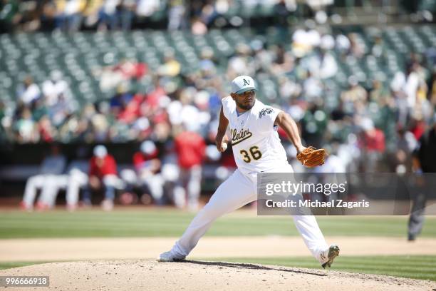 Yusmeiro Petit of the Oakland Athletics pitches during the game against the Los Angeles Angels of Anaheim at the Oakland Alameda Coliseum on June 17,...