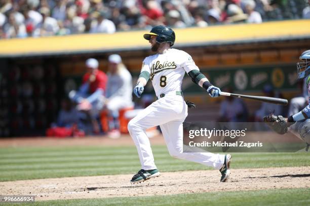 Jed Lowrie of the Oakland Athletics bats during the game against the Los Angeles Angels of Anaheim at the Oakland Alameda Coliseum on June 17, 2018...