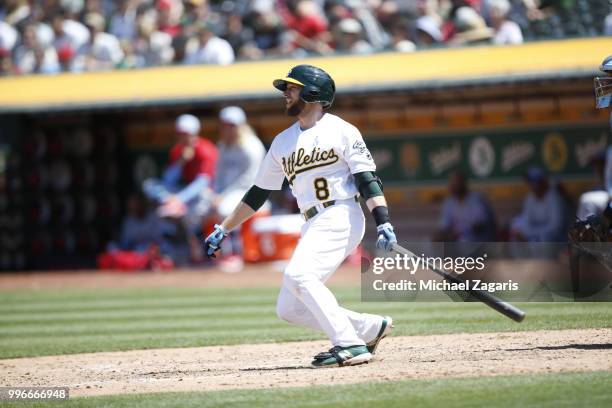 Jed Lowrie of the Oakland Athletics bats during the game against the Los Angeles Angels of Anaheim at the Oakland Alameda Coliseum on June 17, 2018...