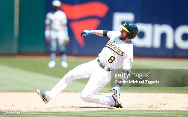 Jed Lowrie of the Oakland Athletics steals second during the game against the Los Angeles Angels of Anaheim at the Oakland Alameda Coliseum on June...