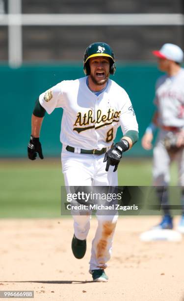 Jed Lowrie of the Oakland Athletics runs the bases during the game against the Los Angeles Angels of Anaheim at the Oakland Alameda Coliseum on June...