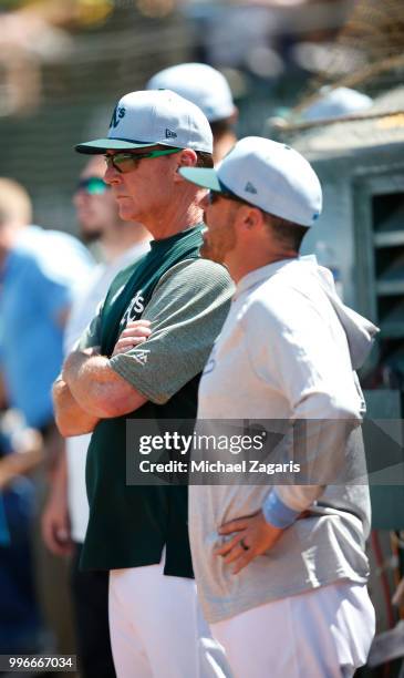 Manager Bob Melvin of the Oakland Athletics stands in the dugout during the game against the Los Angeles Angels of Anaheim at the Oakland Alameda...