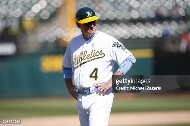 Third Base Coach Matt Williams of the Oakland Athletics stands on the field during the game against the Los Angeles Angels of Anaheim at the Oakland...