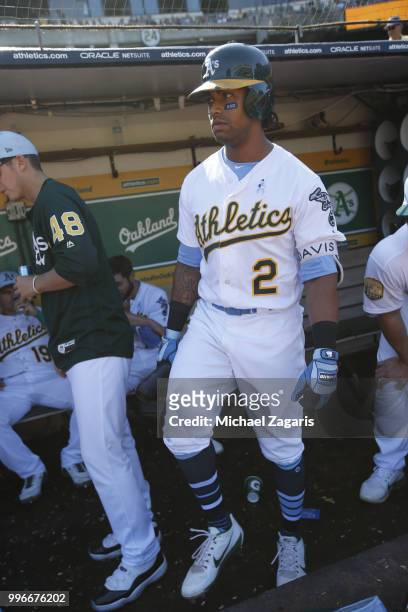 Khris Davis of the Oakland Athletics stands in the dugout during the game against the Los Angeles Angels of Anaheim at the Oakland Alameda Coliseum...