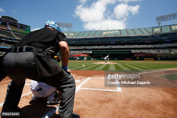 Daniel Mengden of the Oakland Athletics warms up from the mound prior to the game against the Los Angeles Angels of Anaheim at the Oakland Alameda...