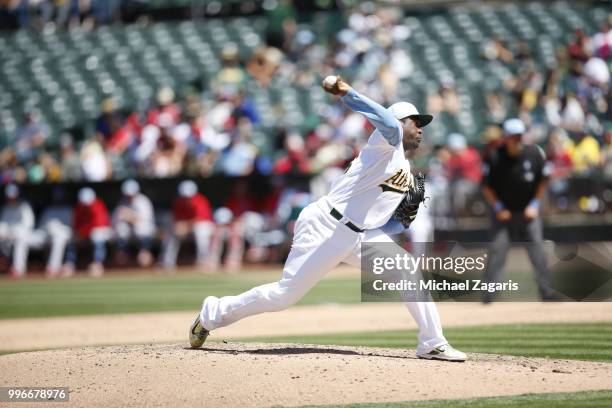 Santiago Casilla of the Oakland Athletics pitches during the game against the Los Angeles Angels of Anaheim at the Oakland Alameda Coliseum on June...