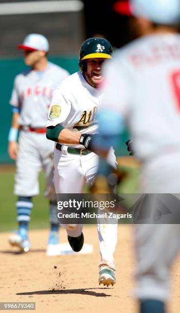 Jed Lowrie of the Oakland Athletics runs the bases during the game against the Los Angeles Angels of Anaheim at the Oakland Alameda Coliseum on June...