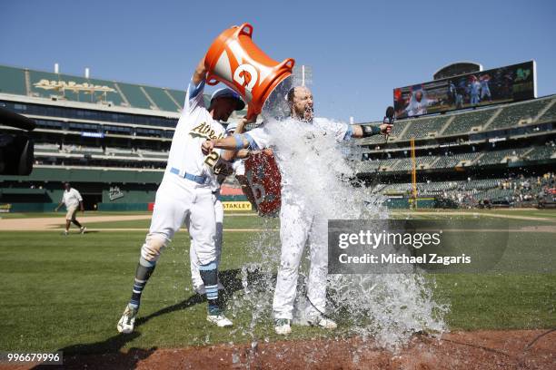 Jonathan Lucroy of the Oakland Athletics gets a Gatorade bath after hitting a walkoff single following the game against the Los Angeles Angels of...