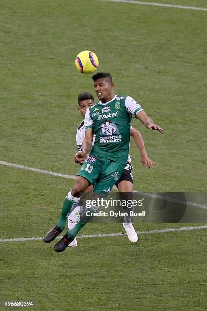 Alexander Mejia of Club Leon heads the ball while being defended by Franco Jara of CF Pachuca in the second half at Miller Park on July 11, 2018 in...