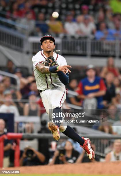 Johan Camargo of the Atlanta Braves makes a throw to first base for the final out of the game against the Toronto Blue Jays at SunTrust Park on July...