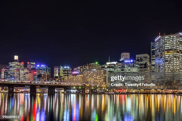 aerial view of sydney skyline from darling harbour at night - darling harbor photos et images de collection