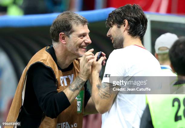 Pundit Slaven Bilic talks to Vedran Corluka of Croatia on the sideline following the 2018 FIFA World Cup Russia Semi Final match between England and...