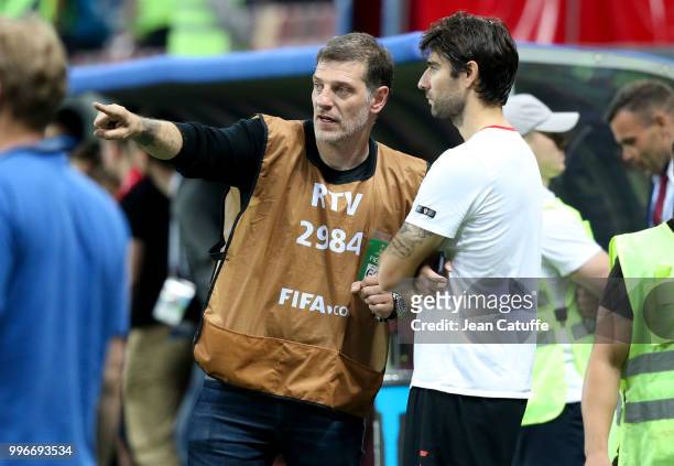 Pundit Slaven Bilic talks to Vedran Corluka of Croatia on the sideline following the 2018 FIFA World Cup Russia Semi Final match between England and...