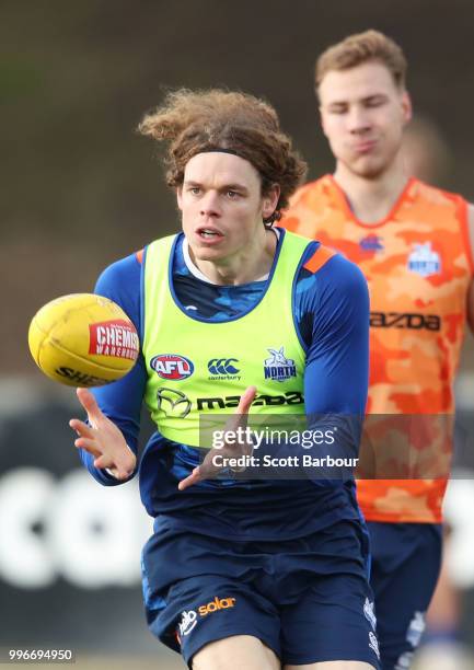 Ben Brown of the Kangaroos runs with the ball during a North Melbourne Kangaroos Training Session on July 12, 2018 in Melbourne, Australia.