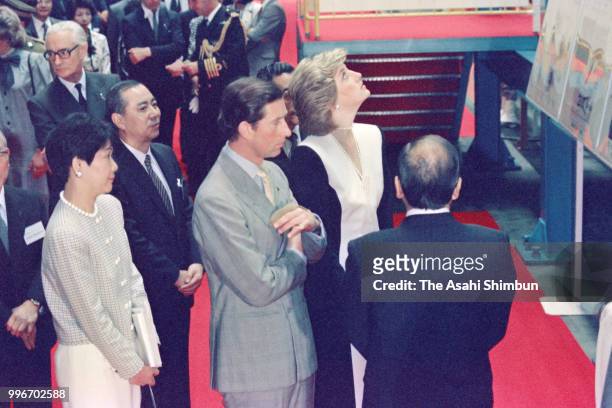 Prince Charles, Prince of Wales and Princess Diana, Princess of Wales inspect the Kawasaki Heavy Industries Kobe Factory on May 10, 1986 in Kobe,...