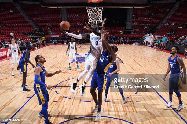 Mangok Mathiang of the Charlotte Hornets goes to the basket against the Golden State Warriors during the 2018 Las Vegas Summer League on July 11,...