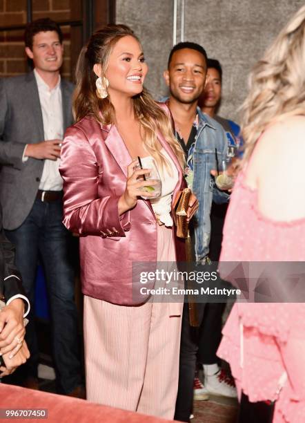 Chrissy Teigen and John Legend attend the Finery App launch party hosted by Brooklyn Decker at Microsoft Lounge on July 11, 2018 in Culver City,...