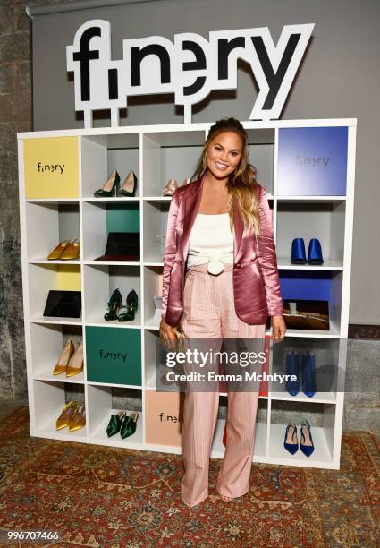 Chrissy Teigen attends the Finery App launch party hosted by Brooklyn Decker at Microsoft Lounge on July 11, 2018 in Culver City, California.