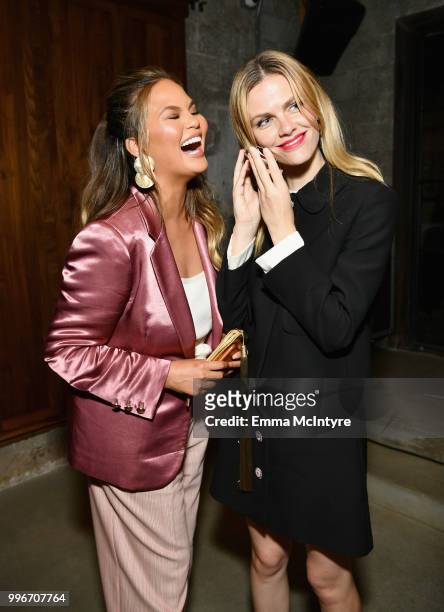 Chrissy Teigen and Finery Co-Founder Brooklyn Decker attend the Finery App launch party hosted by Brooklyn Decker at Microsoft Lounge on July 11,...