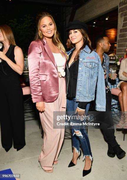 Chrissy Teigen and Noureen DeWulf attend the Finery App launch party hosted by Brooklyn Decker at Microsoft Lounge on July 11, 2018 in Culver City,...