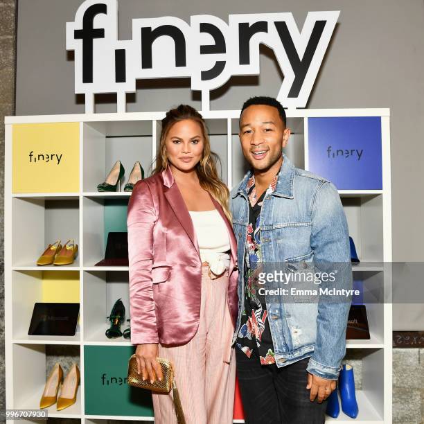 Chrissy Teigen and John Legend attend the Finery App launch party hosted by Brooklyn Decker at Microsoft Lounge on July 11, 2018 in Culver City,...
