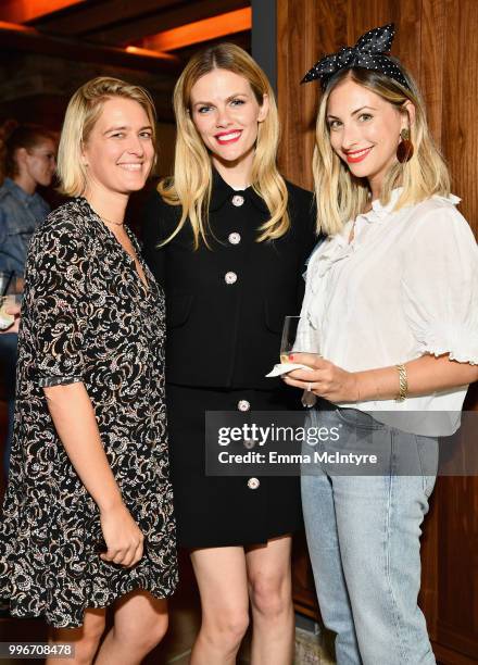 Guest, Finery Co-Founder Brooklyn Decker and Emily Schuman attend the Finery App launch party hosted by Brooklyn Decker at Microsoft Lounge on July...