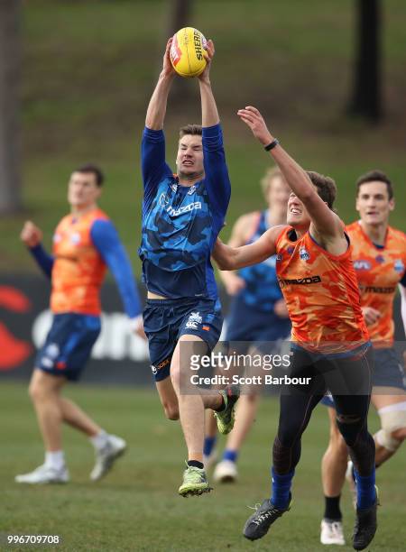Kayne Turner of the Kangaroos marks the ball during a North Melbourne Kangaroos Training Session on July 12, 2018 in Melbourne, Australia.