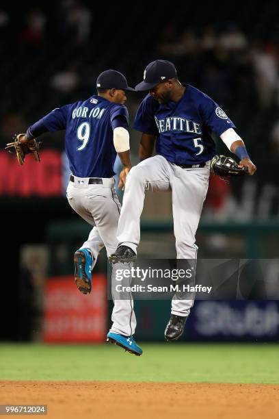 Dee Gordon and Guillermo Heredia of the Seattle Mariners celebrate defeating the Los Angeles Angels of Anaheim 3-0 in a game at Angel Stadium on July...