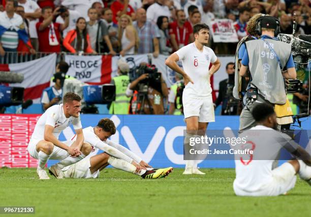 Jamie Vardy, Dele Alli, Harry Maguire of England are dejected following the 2018 FIFA World Cup Russia Semi Final match between England and Croatia...