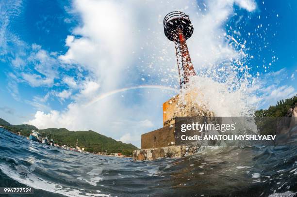 lighthouse & rainbow - lighthouse reef stock pictures, royalty-free photos & images