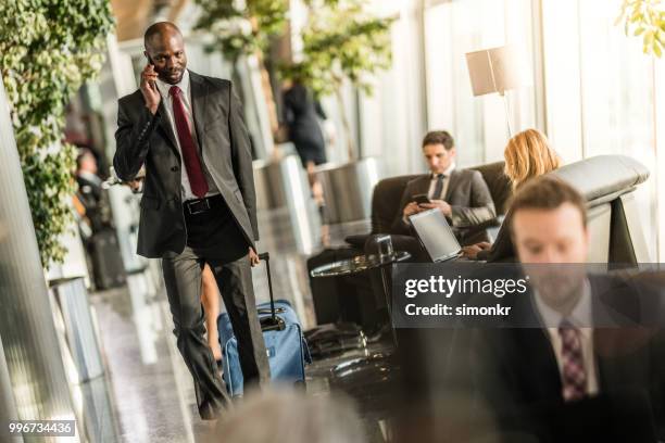 business people at airport - technophile stock pictures, royalty-free photos & images