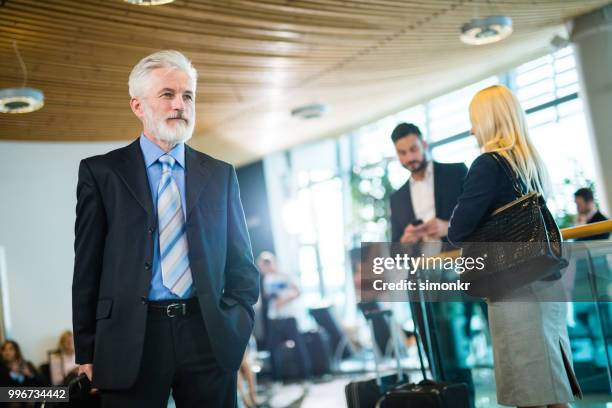business people at airport - technophile stock pictures, royalty-free photos & images