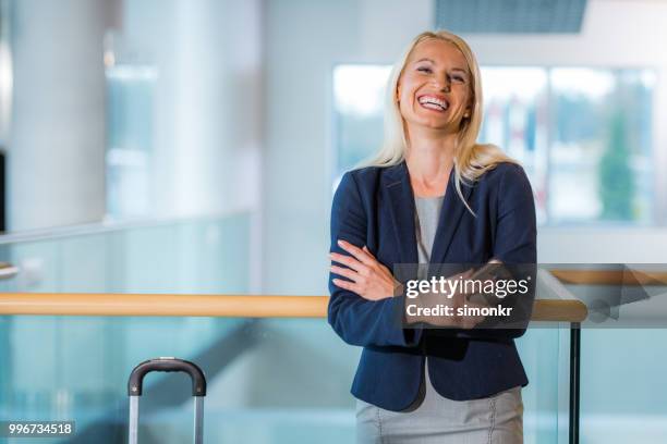 portrait of businesswoman at airport - technophile stock pictures, royalty-free photos & images