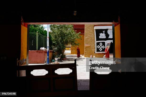 tibet, china - june 14, 2018: the monks of the shadrubling temple. shad lulin temple is located in gongga county, shannan district, tibet autonomous region. this is a tibetan buddhist gelugpa temple. it is the only living buddha with the body of a thousan - tibet autonomous region stock pictures, royalty-free photos & images