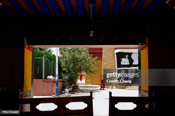 tibet, china - june 14, 2018: the monks of the shadrubling temple. shad lulin temple is located in gongga county, shannan district, tibet autonomous region. this is a tibetan buddhist gelugpa temple. it is the only living buddha with the body of a thousan - tibet autonomous region stock pictures, royalty-free photos & images