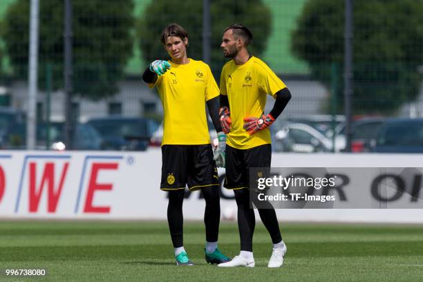 Goalkeeper Marwin Hitz of Dortmund and Goalkeeper Eric Oelschlaegel of Dortmund looks on during a training session at BVB trainings center on July 9,...