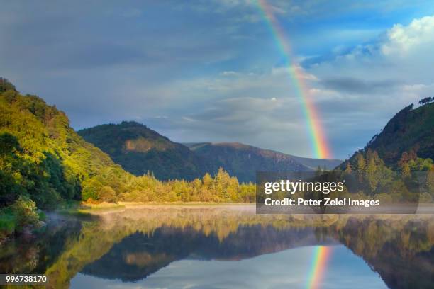 the lower lake in glendalough, county wicklow, ireland - landscap with rainbow fotografías e imágenes de stock