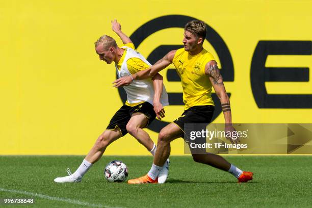 Sebastian Rode of Dortmund and Maximilian Philipp of Dortmund battle for the ball during a training session at BVB trainings center on July 9, 2018...